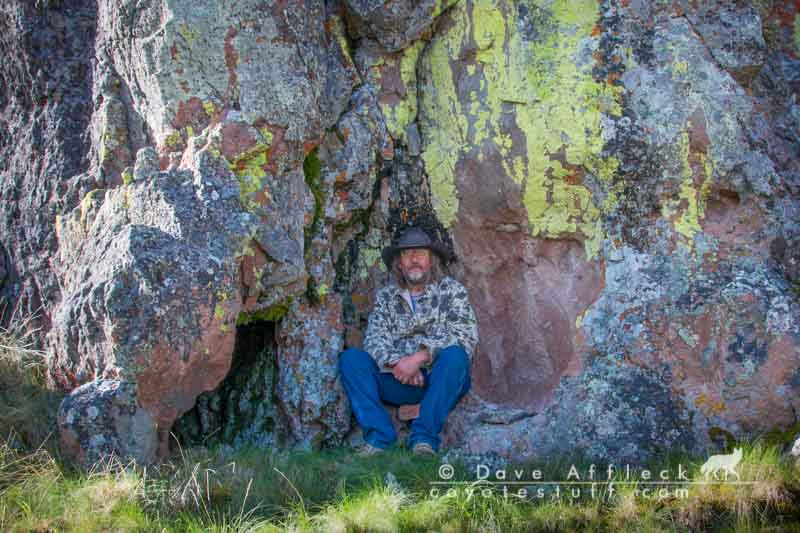 Tim sitting in front of colorful rocks